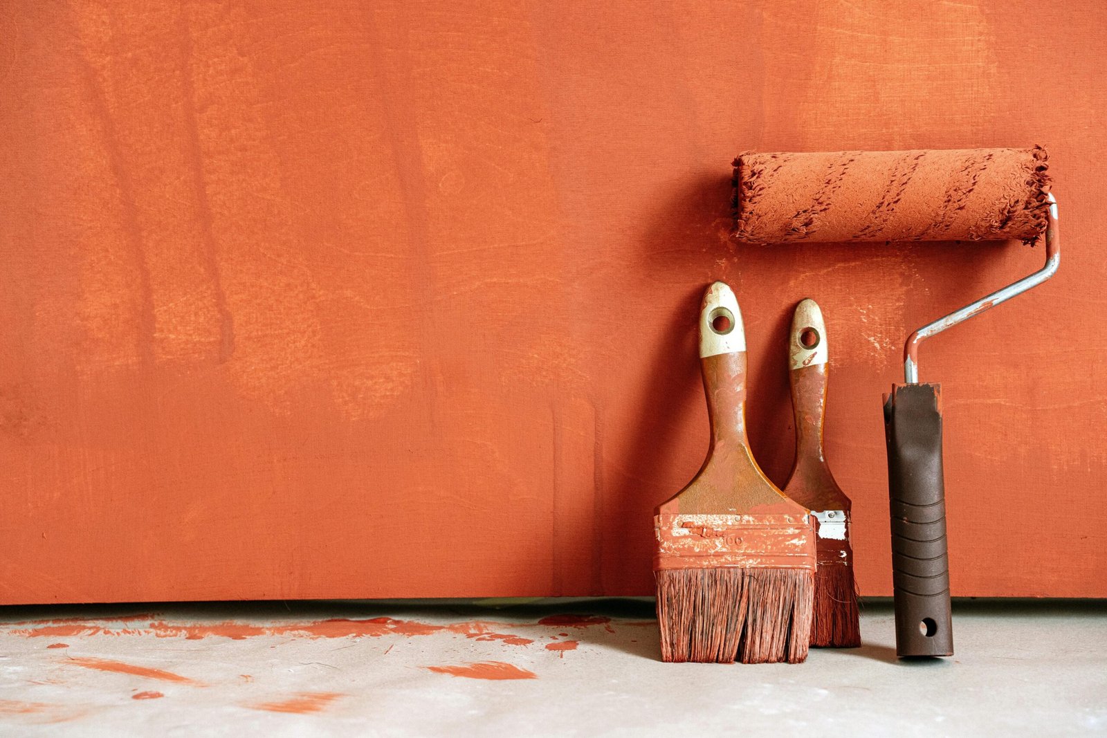 Premium home painting services banner with professional paint brushes and roller tools in Singapore